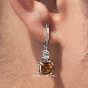 [In ear front view of asscher cut moissanite dangle drop earrings]-[Golden Bird Jewels]