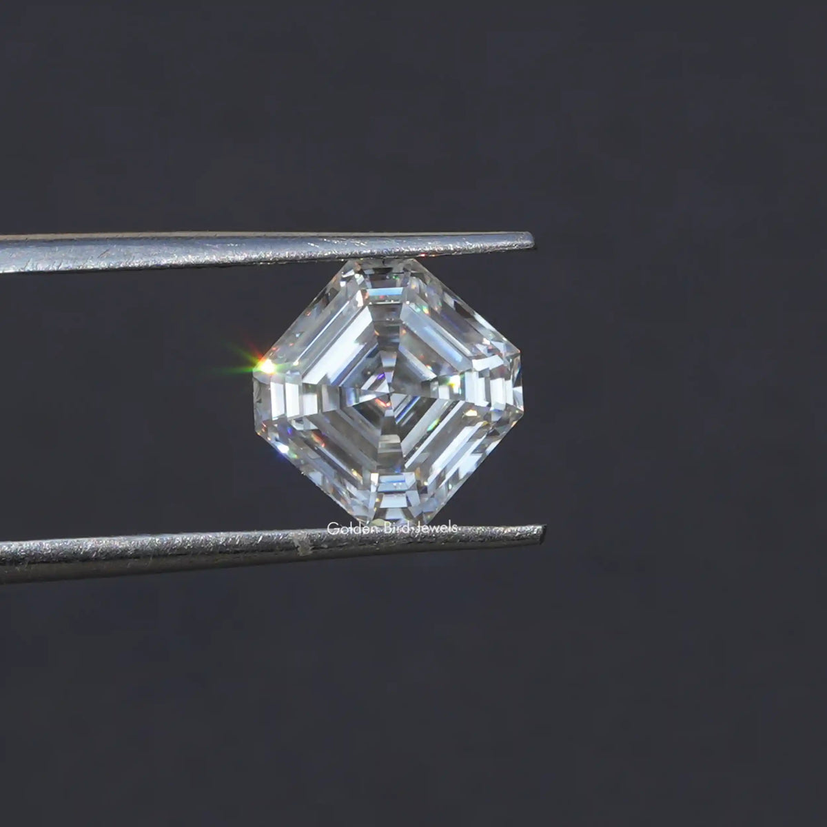 Tweezer holding the  Moissanite Asscher Cut Loose Stone