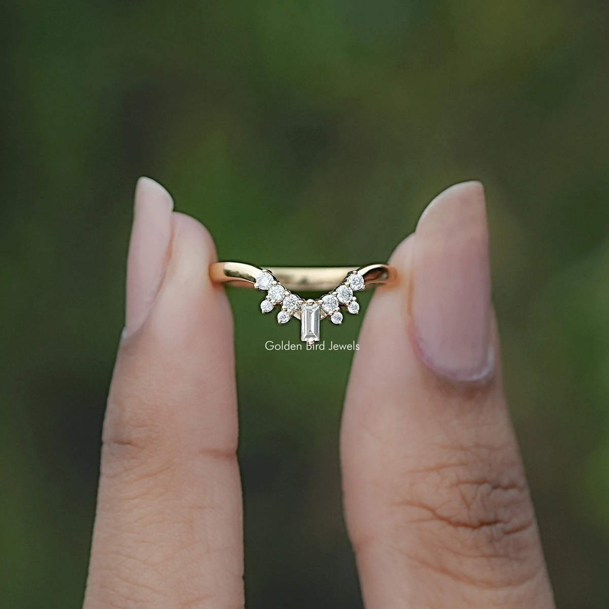 Front view of Baguette And Round Moissanite Chevron Band