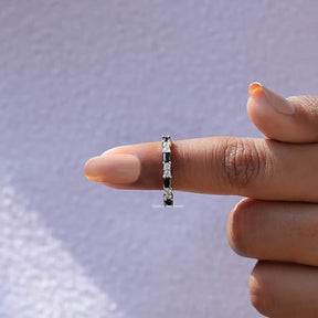 In finger front View of Baguette And Round Cut Eternity Band In White Gold