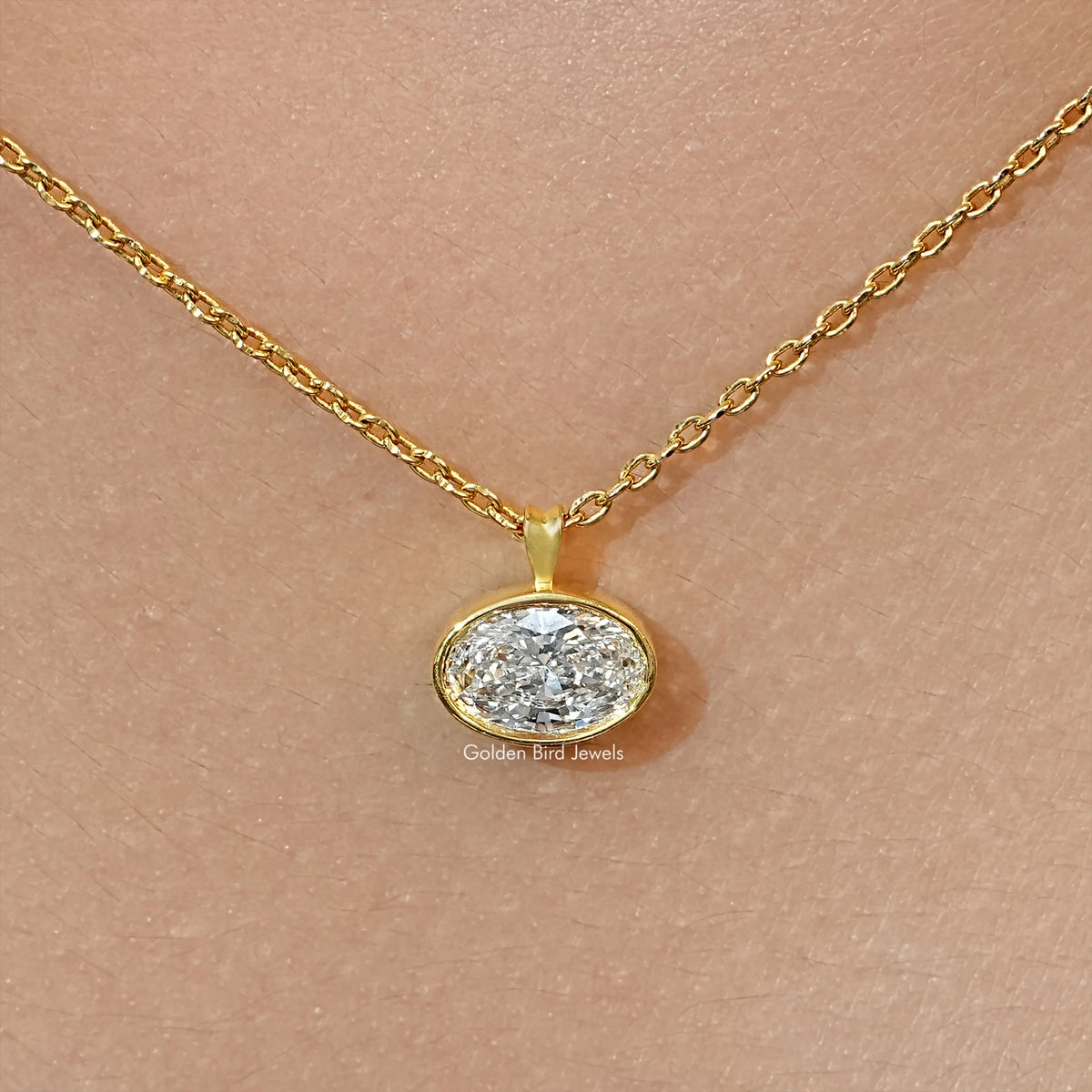 Gold-tone oval lab diamond solitaire pendant on chain