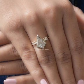 [In finger front view of kite cut moissanite engagement ring made of round cut side stones]-[Golden Bird Jewels]