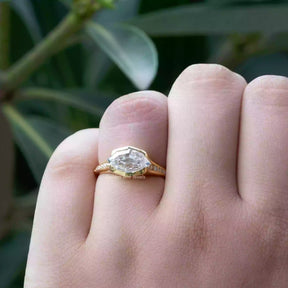 [In finger front view of step cut marquise cut moissanite wedding ring crafted with round cut side stones]-[Golden Bird Jewels]