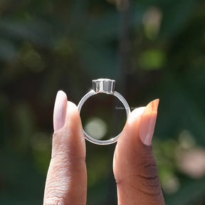 Back View of Oval Cut Moissanite Ring In two fingers