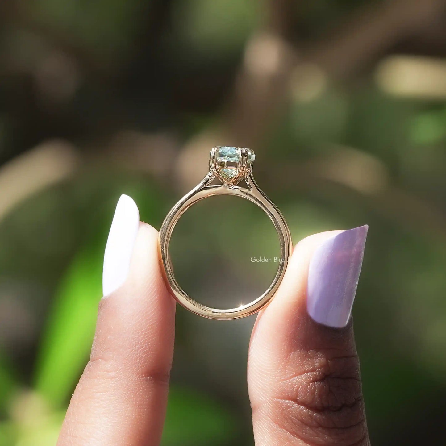 Back view of marquise solitaire  ring   in a secure setting
