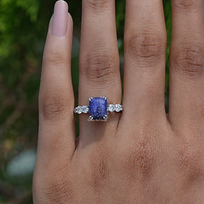 Blue Emerald Cut Accent Stone Ring In White Gold