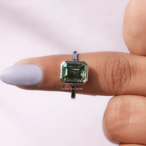 Front View of Green Emerald Cut Moissanite Solitare Ring In a finger