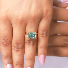 Detailed View Of Blue Radiant Cut Moissanite Engagement Ring In Yellow Gold
