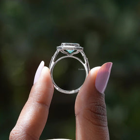 Back View of Radiant Cut Moissanite Engagement Ring In two fingers
