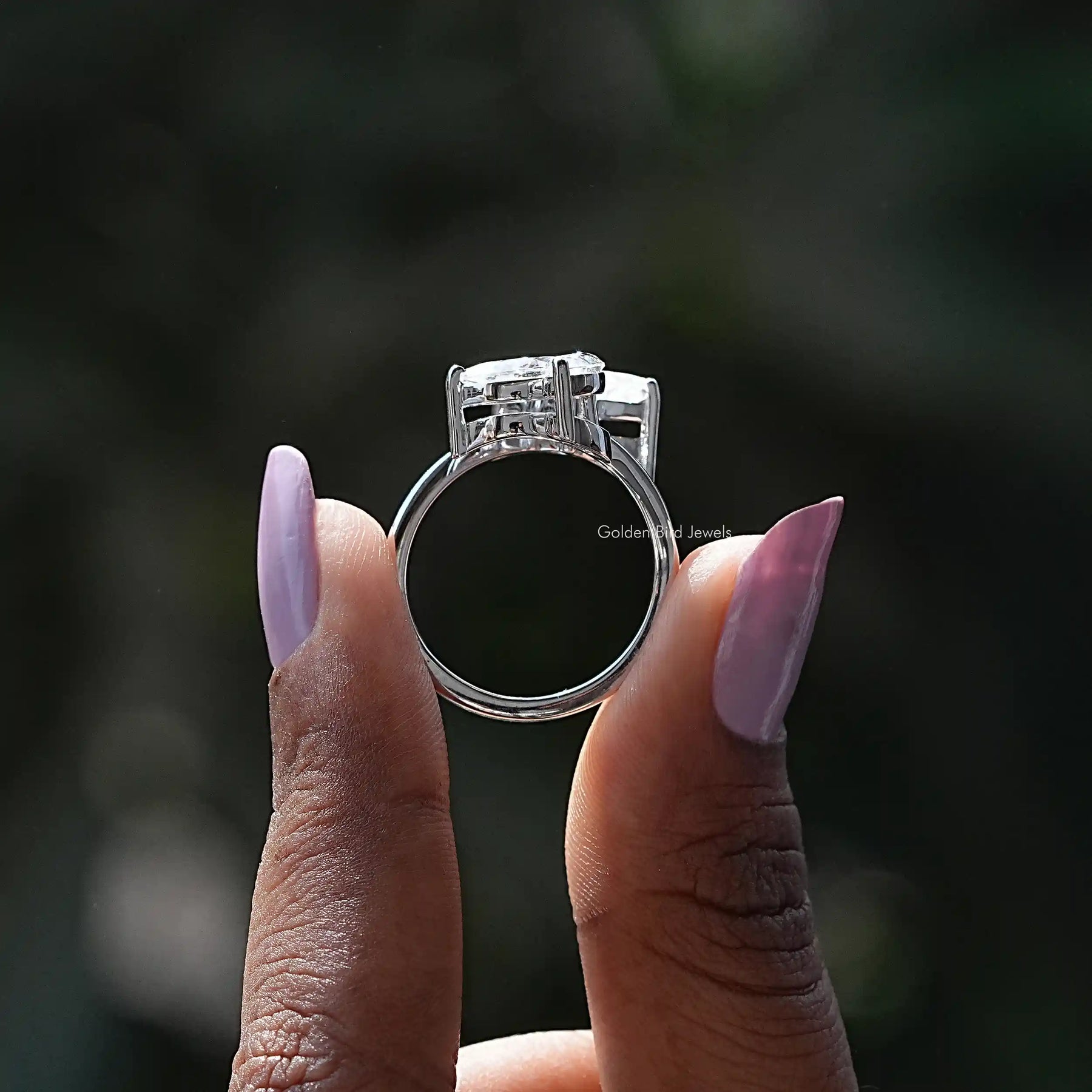 Back View of Moissanite Butterfly Cut Bypass Ring In two fingers