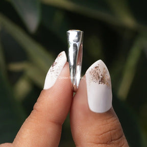 Side View of Criss Cut Moissanite Solitaire Ring In two fingers
