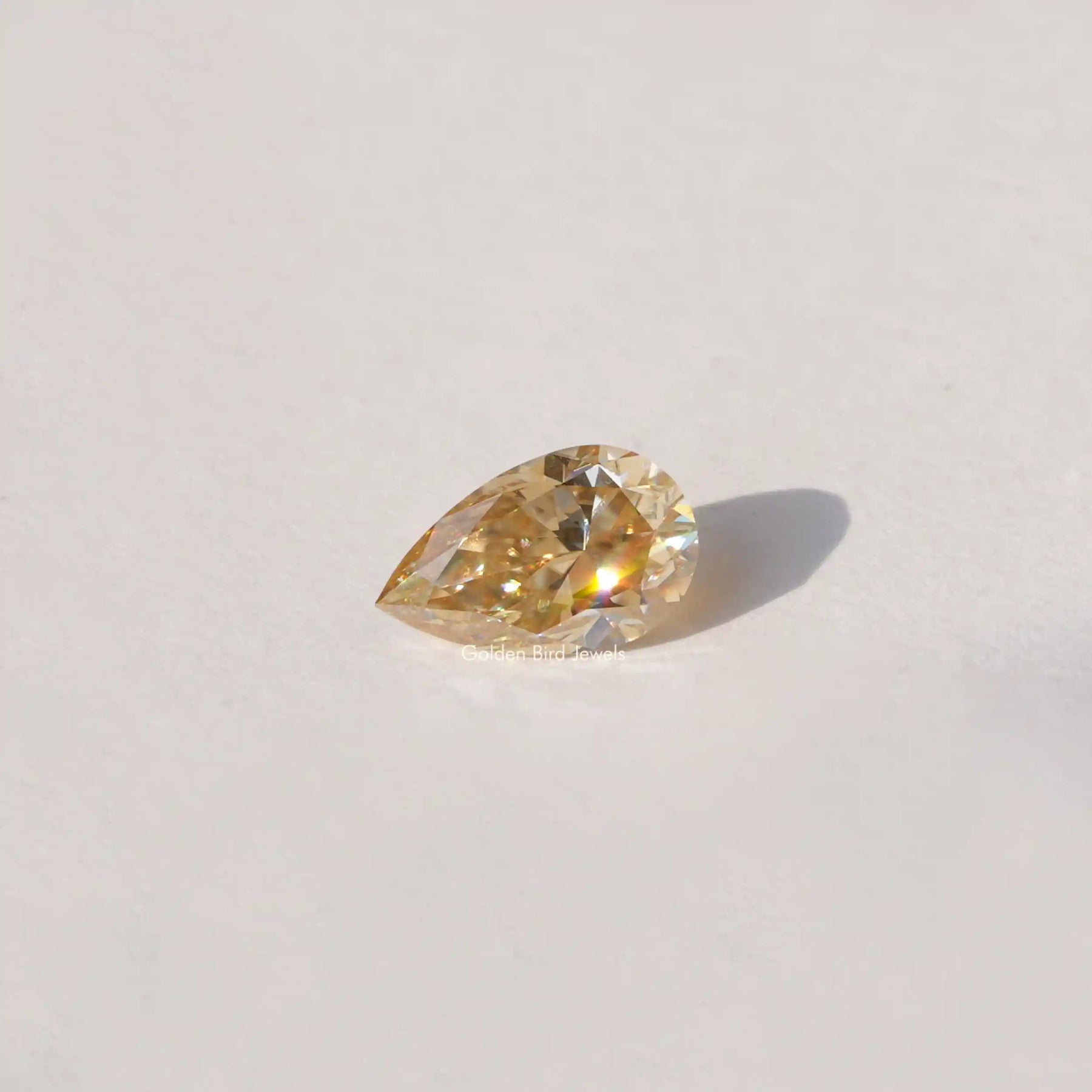 [Side view of old mine pear cut loose stone]-[Golden Bird Jewels]