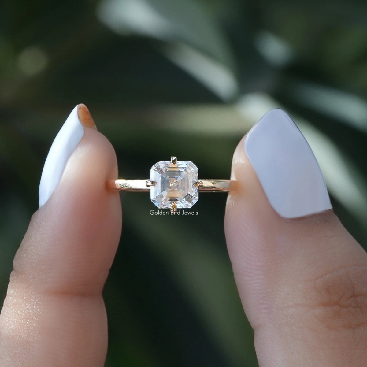 Front View of Asscher Cut Moissanite Engagement Ring In two Fingers