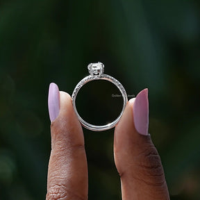 Back View of Moissanite Hexagon Cut Bridal Ring Set In two fingers