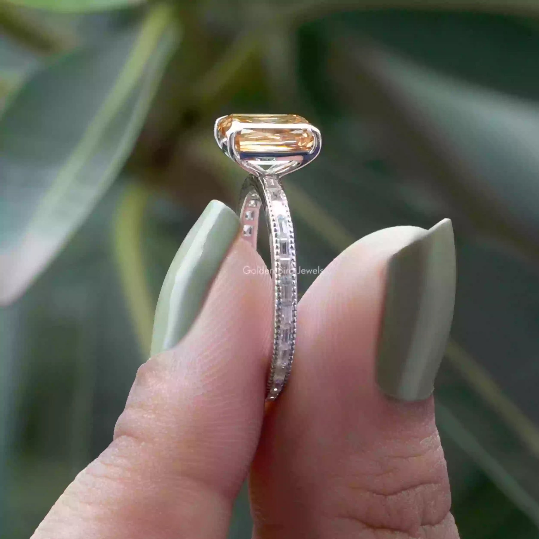 [In two finger side view of champagne criss cut moissanite ring in 14k white gold]-[Golden Bird Jewels]