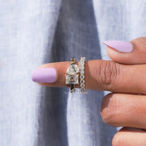 In finger front view of Pear Cut Moissanite Eternity Wedding Band In Yellow gold