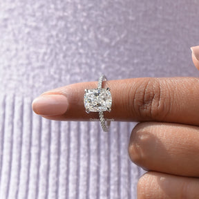 In finger front View of Ice Cushion Cut Moissanite Hidden Halo White Gold Ring