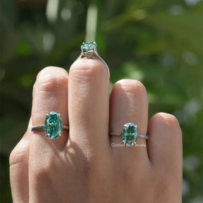 [In finger front view of moissanite oval cut ring set in cathedral setting]-[Golden Bird Jewels]