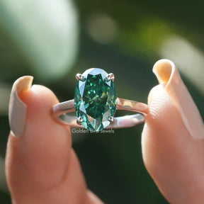 [In two finger front view of ice oval cut solitaire ring made in 18k white gold]-[Golden Bird Jewels]