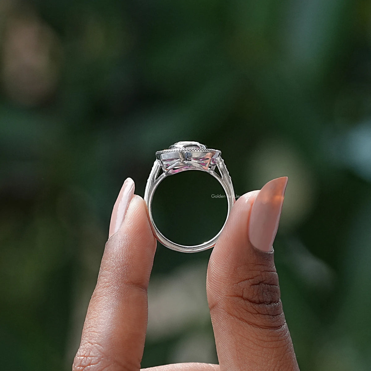 Back View of Moissanite Oval Cut Halo White Gold Ring In two fingers