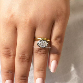 [in finger front viewof crushed ice oval cut moissanite ring]-[Golden Bird Jewels]