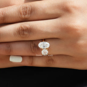 [In finger front view of crushed ice oval and round cut moissanite ring]-[Golden Bird Jewels]