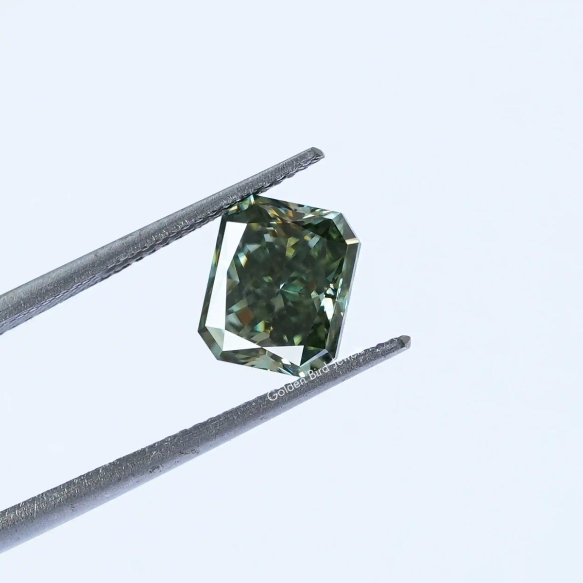 Tweezer view of Blue Green Radiant Cut Loose Stone
