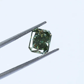 Tweezer view of Blue Green Radiant Cut Loose Stone