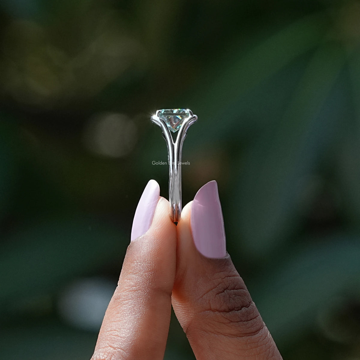 Side View of Radiant Cut Moissanite Solitaire Ring In two fingers