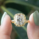 [In two finger front view of cushion cut bezel set ring made of 14k yellow gold]-[Golden Bird Jewels]
