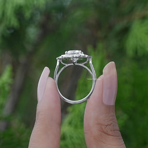 Back View of A Cushion Cut Moissanite Halo Ring In two fingers