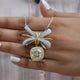 Front view of cushion cut moissanite halo pendant