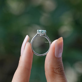 Back View of Moissanite Portuguese Cut Ring In two fingers