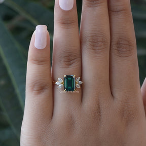 [In finger front view of dark green emerald cut ring made of side marquise stones]-[Golden Bird Jewels]