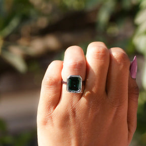View of Green Emerald Cut Solitaire Ring In White Gold