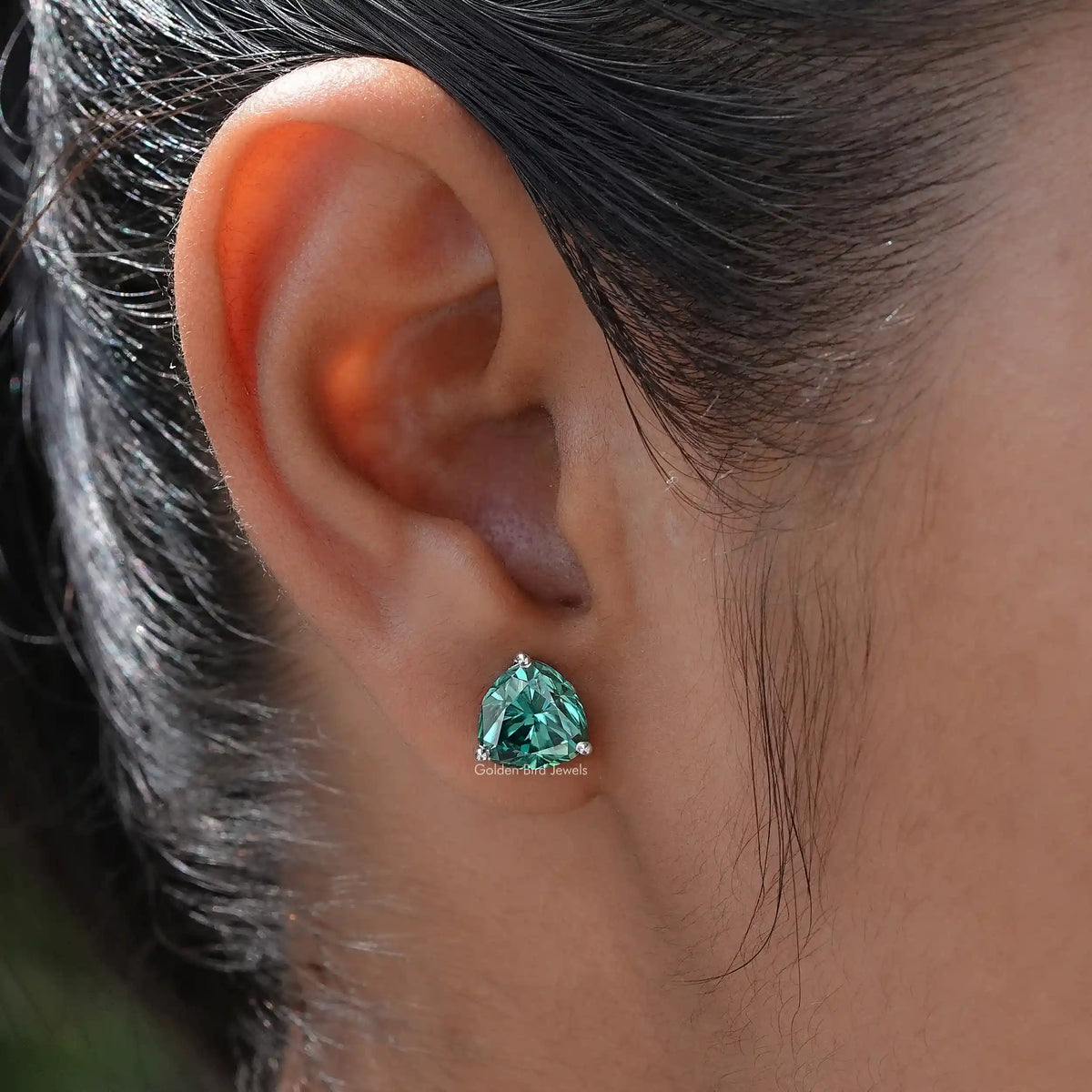 In Ear view of trillion Cut moissanite Stud Earrings 