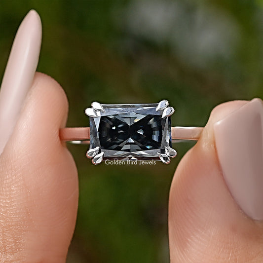 Silver solitaire engagement ring with square black gemstone and four-prong setting