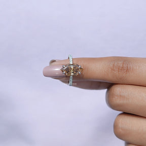 In finger front view of dutch marquise moissanite  in secure setting 