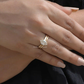 In finger top view of halo moissanite  engagement ring in prongs setting 
