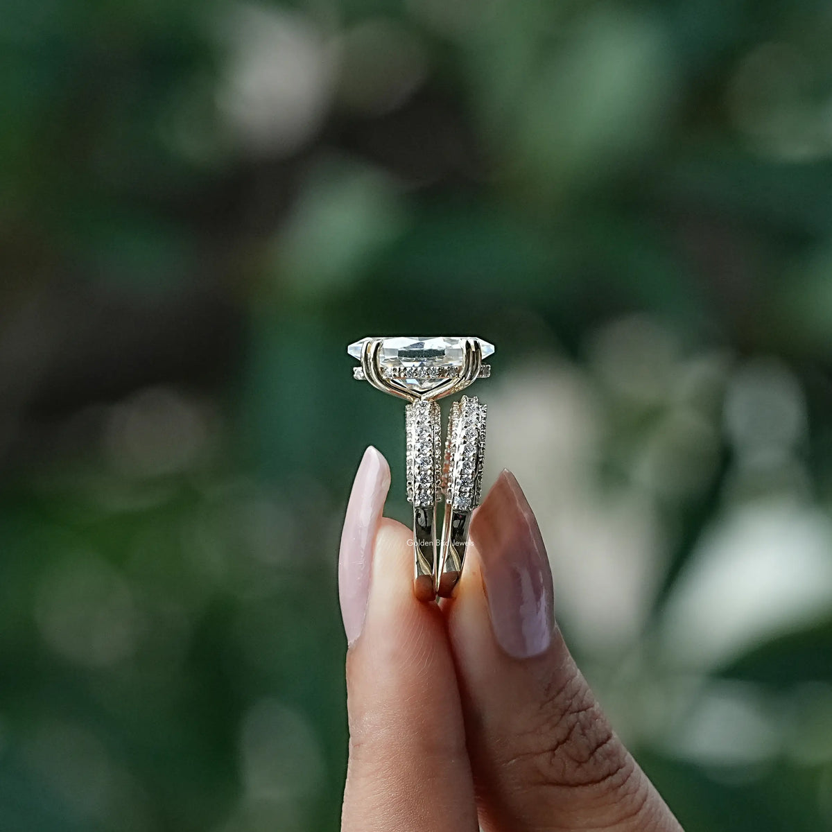 Side View of Dutch Marquise Cut Moissanite Ring In two fingers