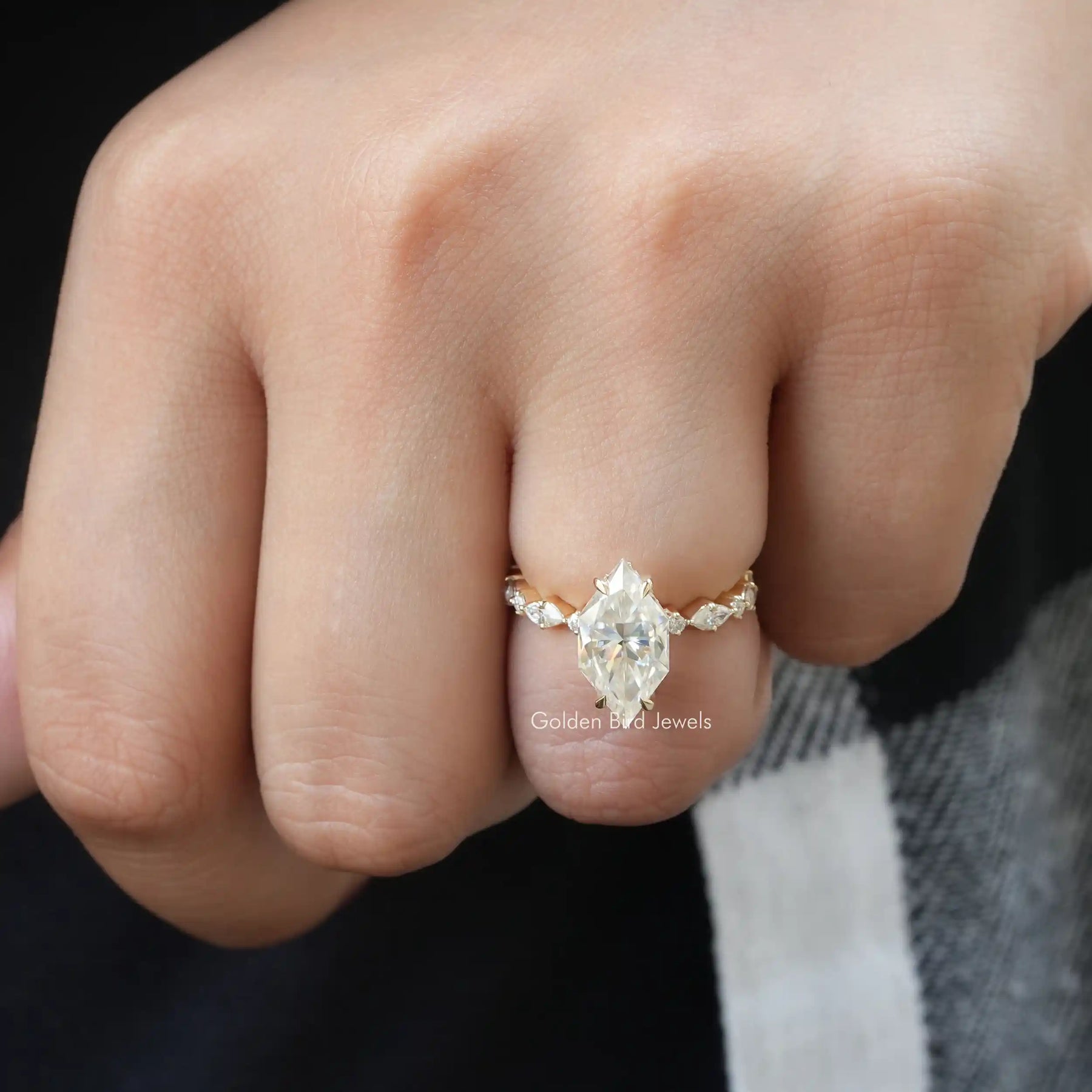 [In finger front view of marquise cut engagement ring made of side round cut stones]-[Golden Bird Jewels]
