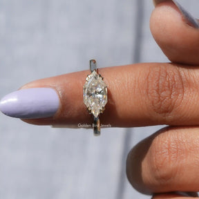 In finger front view of Dutch Marquise East West Ring In Yellow Gold