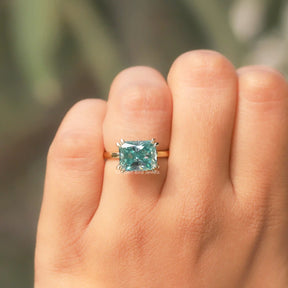 View of East West Radiant Cut Moissanite Ring In Yellow Gold