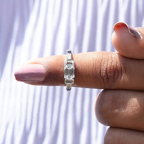 In finger front View of 5 Stone Emerald Cut Moissanite Ring In White Gold