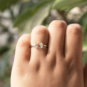 Colorless Marquise And Emerald Cut Open moissanite Ring in a secure setting 