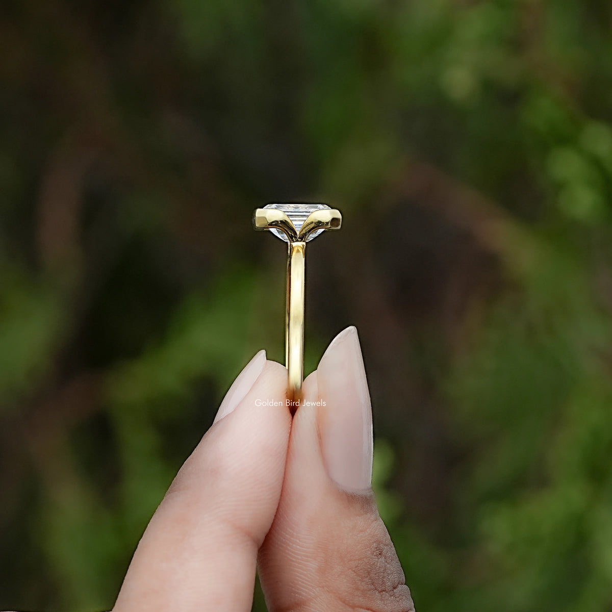 Side View of Emerald Diamond Bezel Set Solitaire Ring