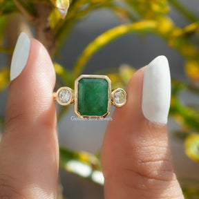 Front View of Emerald Cut Moissanite Bezel Set Three Stone Ring In Finger