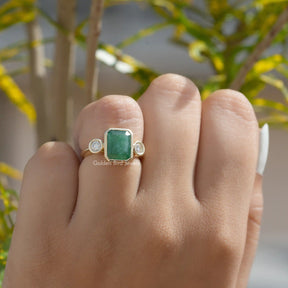 [This three stone moissanite ring made with round and emerald cut stones]-[Golden Bird  Jewels]