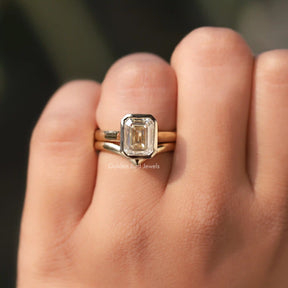 [In finger front view of bezel set emerald cut ring with curved band]-[Golden Bird Jewels]