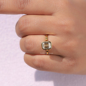 Emerald Cut Solitaire Engagement Ring In Yellow Gold